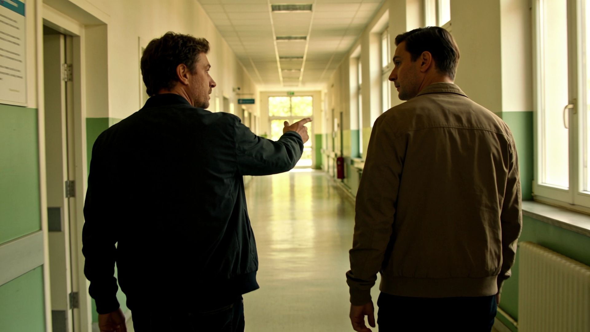 Two people talking in a hospital corridor